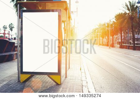 Blank billboard with copy space area for your text message or promotional content public information board on the street advertising mock up empty banner in metropolitan city at beautiful evening