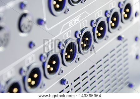 linear series of xlr conector. Rear of control panel active studio monitor.