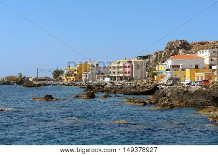 Houses at rocky coastline of Paleochora town on Crete island, Greece
