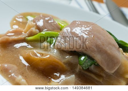 Rad Na, Famous Thai Chinese Style Wide Rice Noodle Dish With Tasty Tender Pork With Thick Gravy Sauc
