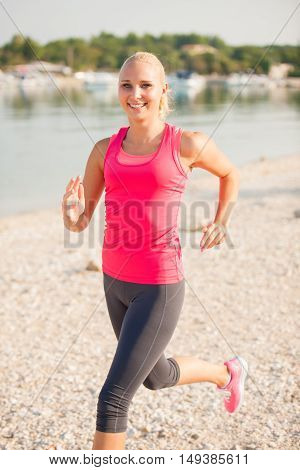 Jogging In Th Beach - Woman Runns Near Sea On Early Summer Morning
