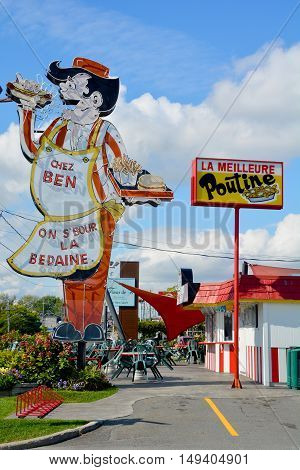 GRANBY QUEBEC CANADA 09 28 2016: Sign of Cantine Ben La Bedaine fast food restaurant some of the best Quebecois comfort food available.