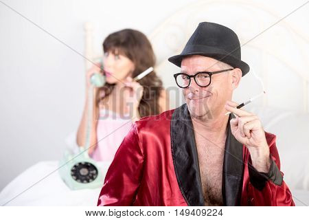 Smoking Playboy With Woman On The Phone In Background