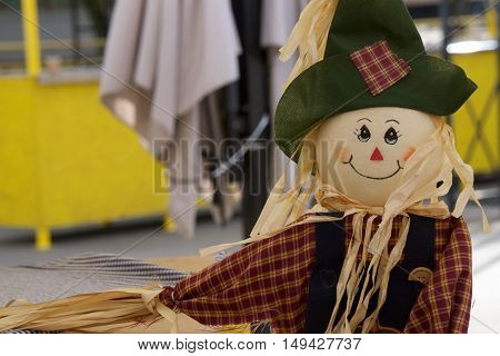 scarecrow in the garden, a toy of hay to scare away crows