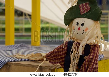 scarecrow in the garden, a toy of hay to scare away crows