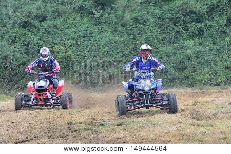 Unidentified Racer Rides A Quad Motorbike.