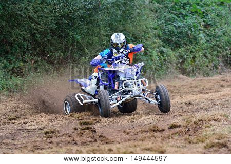 Unidentified Racer Rides A Quad Motorbike.