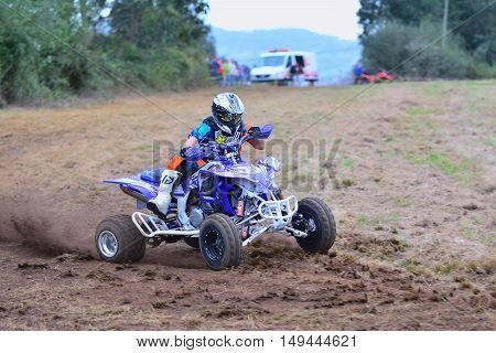 Unidentified Racer Rides A Quad Motorbike.