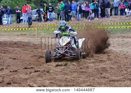 Unidentified Racer Rides A Quad Motorbike.