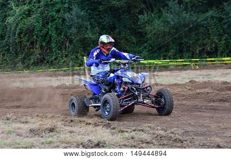 Unidentified Racer Rides A Quad Motorbike.