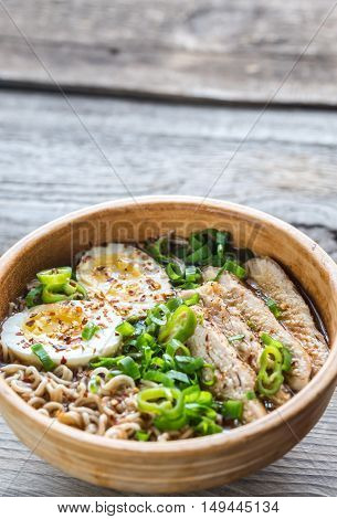 Bowl Of Chicken Ramen Soup On The Wooden Table