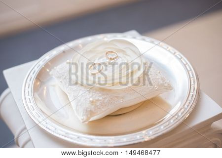 wedding details of a ring on a white substrate