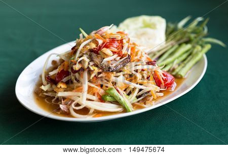 Papaya Salad Thai style (Som tum ) serve with fresh grees vegetable
