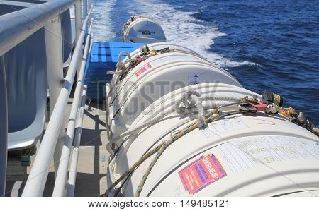 SAINT-TROPEZ FRANCE - AUGUST 21 2016: Life raft cannisters and other safety equipment on a passenger ferry across the Mediterranean