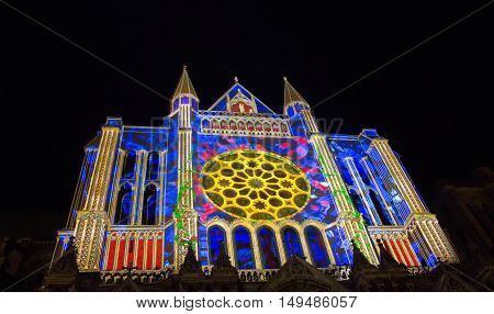 The Our Lady of Chartres cathedral illuminated during Chartres Light show. Colorful light illumine historic places and some principal buildings throughout the event.