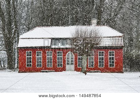 View of a snow covered Hovdala Castle Orangery in Hassleholm region. Hovdala Castle is a castle in Hassleholm Municipality Scania in southern Sweden.