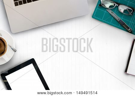 Top view of White desk with office supplies with copy space.