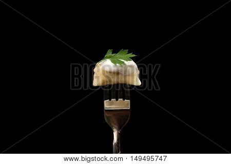 Pelmeni - Russian cuisine meat dumplings single on fork