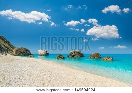Megali Petra Beach, Lefkada Island, Greece. A beautiful beach with large rocks in the water.