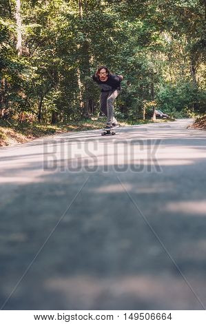 Longboard Skating - Skateboarder Ride A Longboard Through The Forest