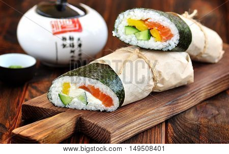 Sushi Burrito with salmon, cucumber, pepper and cream cheese