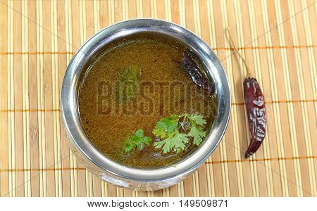 Rasam is a traditional indian soup made out of curry powder and lentil. It is eaten with rice as part of the Indian lunch.