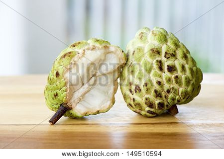 Sugar apple on wood table with blurry background