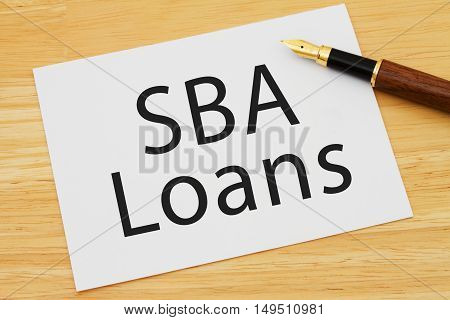Getting a SBA Loan A card and pen on a desk with text SBA Loan