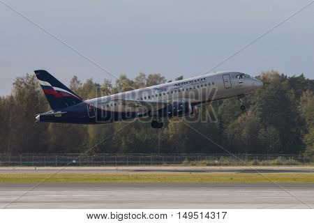 RIGA - SEPTEMBER 27: airBaltic new Bombardier CSeries passenger jet on display at Riga Airport - September 27, 2016 in Riga, Latvia