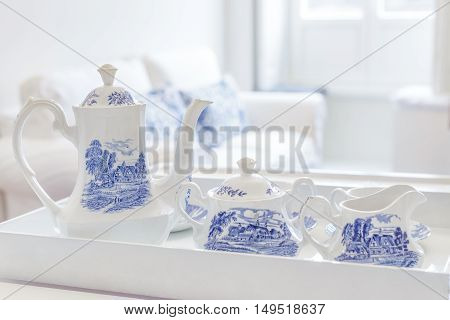 Breakfast tea service on a tray in a bright room