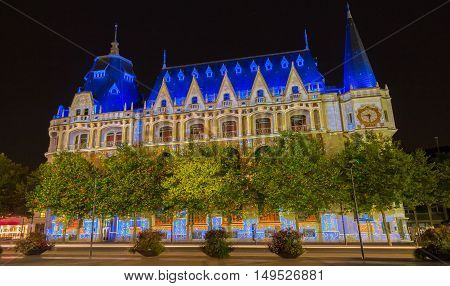 The media library Apostrophe illuminated during Chartres Light show. Colorful light illumine historic places and some principal buildings throughout the event.