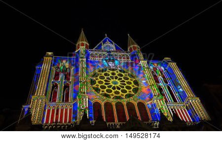 The Our Lady of Chartres cathedral illuminated during Chartres Light show. Colorful light illumine historic places and some principal buildings throughout the event.