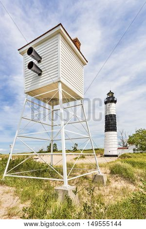 The Big Sable Point Lighthouse in Michigan's Ludington State Park is accompanied by a foghorn tower.
