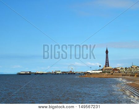 Blackpool tower and North pier with incoming tide