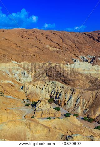 Ancient mountains in the valley of the Dead Sea. Picturesque multicolored sandstone dry talus