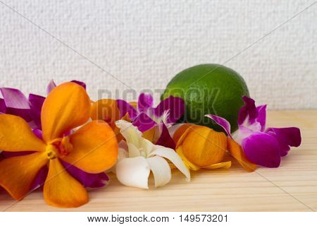 tropical flower on wood table . .