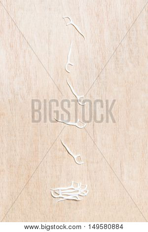 Oral Device : Dental Flossers On Wooden Background