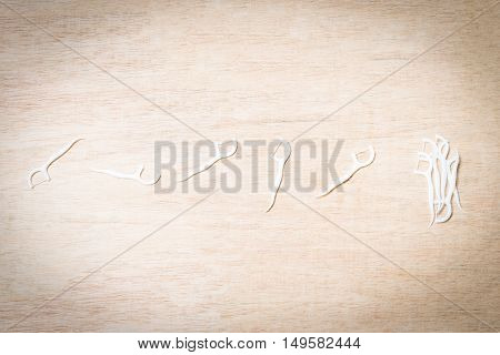 Oral Device : Dental Flossers On Wooden Background