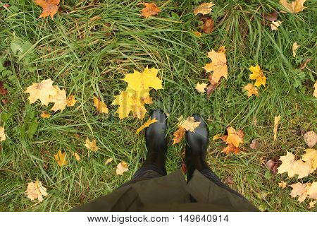black rubber boots on a grass background