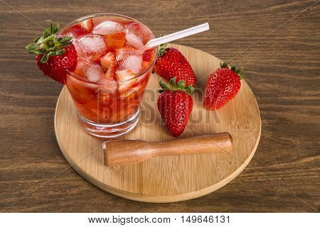 Fresh Made Strawberry Caipirinha On Wooden Background