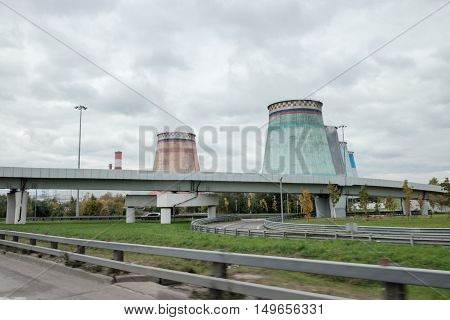 Thermal power stations and power lines on a cloudy day. Industrial landscape