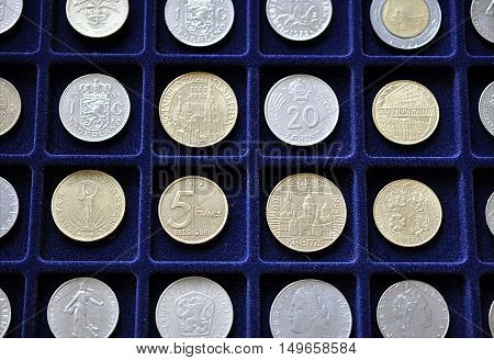 Detailed view of the historical collections of coins and a blue mat