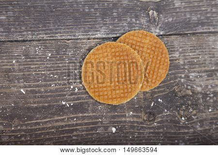 Dutch cookie stroopwafels on brown wooden background