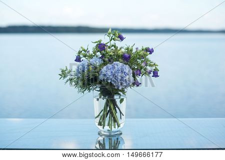 wedding decor on tables flowers blue and violet