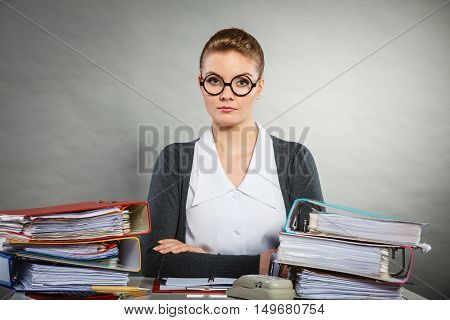 Paperwork administration bureau clerk concept. Young happy secretary at work. Office lady doing her job.