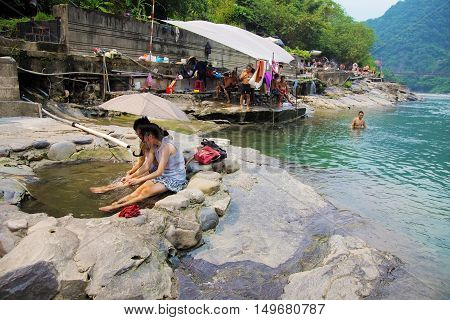 TAIPEI TAIWAN - AUGUST 27: Taiwanese people enjoying the hot springs in the famous hot spring village of Wulai on August 27th 2014 in Taiwan