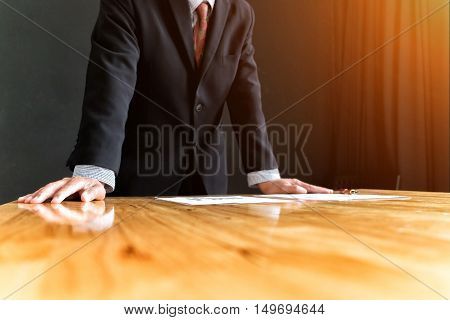 businessman in suit looking and tink vision of business in office business concept soft focus vintage tone