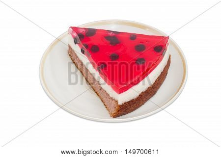 Piece of layered cake with layers of sponge cake milk jelly and berry jelly on a saucer on a light background