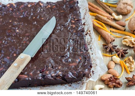 Panforte traditional italian christmas dessert with nuts and candied fruits on parchment horizontal