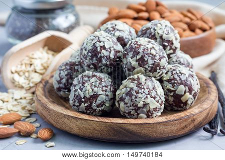 Healthy homemade paleo chocolate energy balls with rolled oats nuts dates and chia seeds horizontal